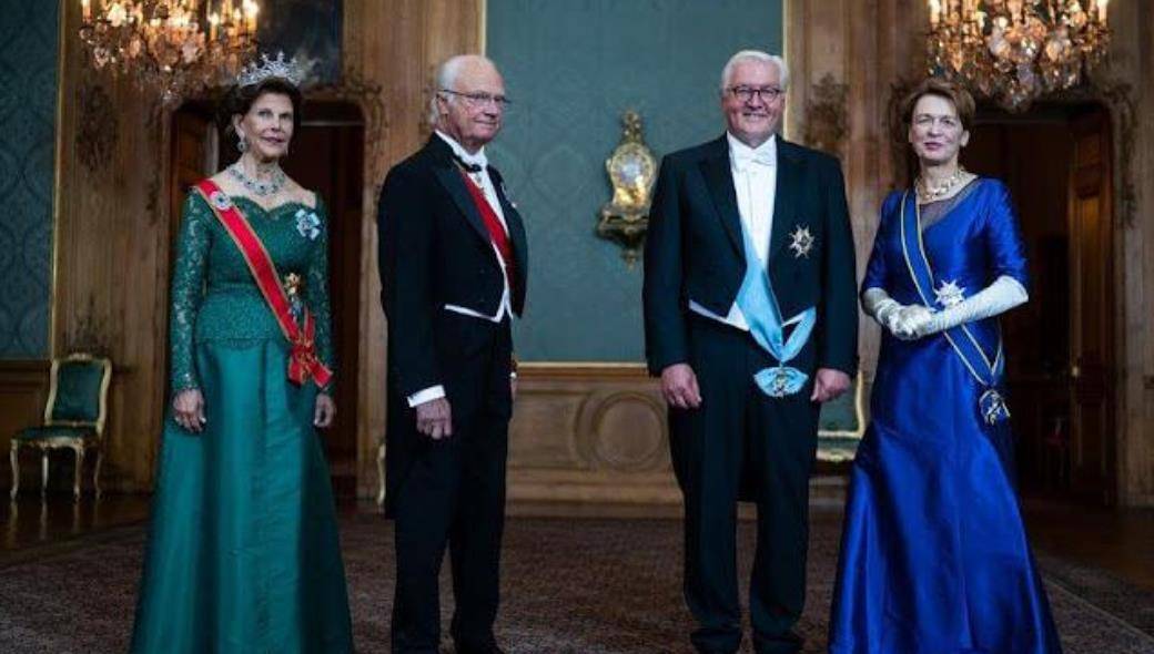 皇冠代理登3平台_德国第一夫人厉害了!穿高贵紫裙接卡米拉皇冠代理登3平台,不戴王冠也能美